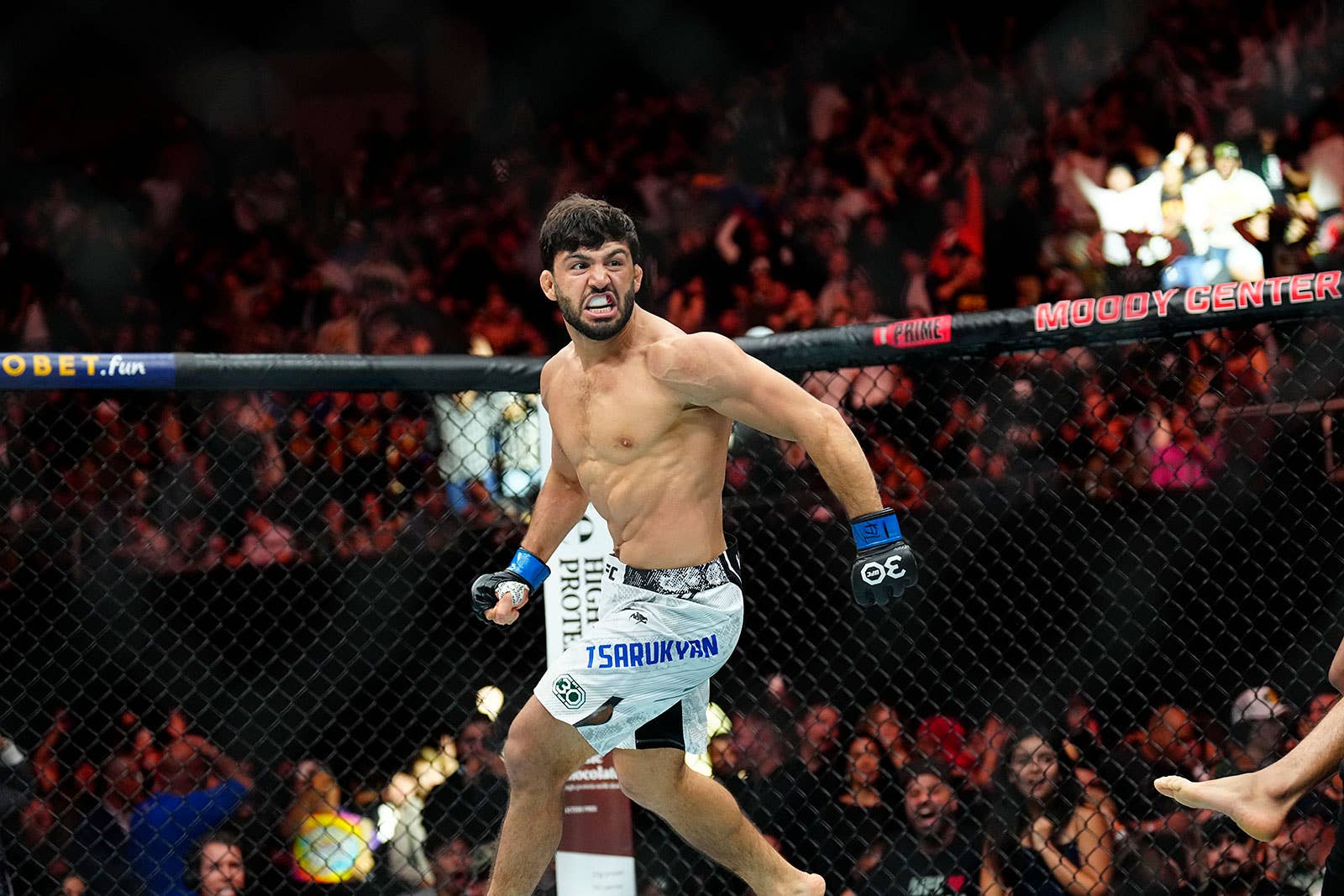 Arman Tsarukyan sends Urijah Faber crashing off the stage during ...