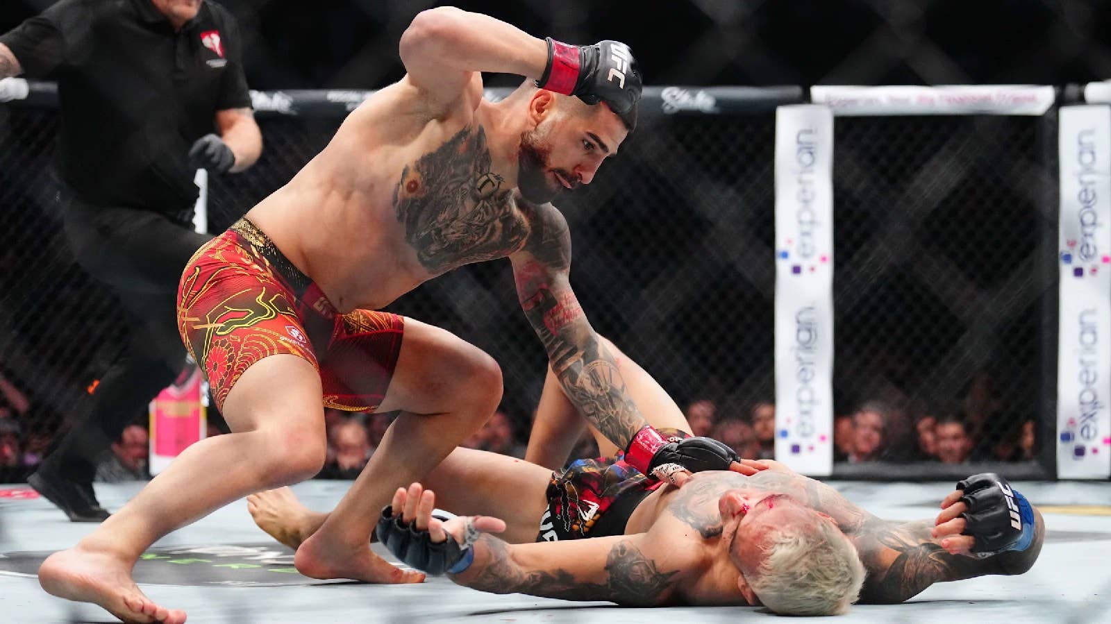 Watch Ilia Topuria flatline Charles Oliveira to win UFC lightweight gold